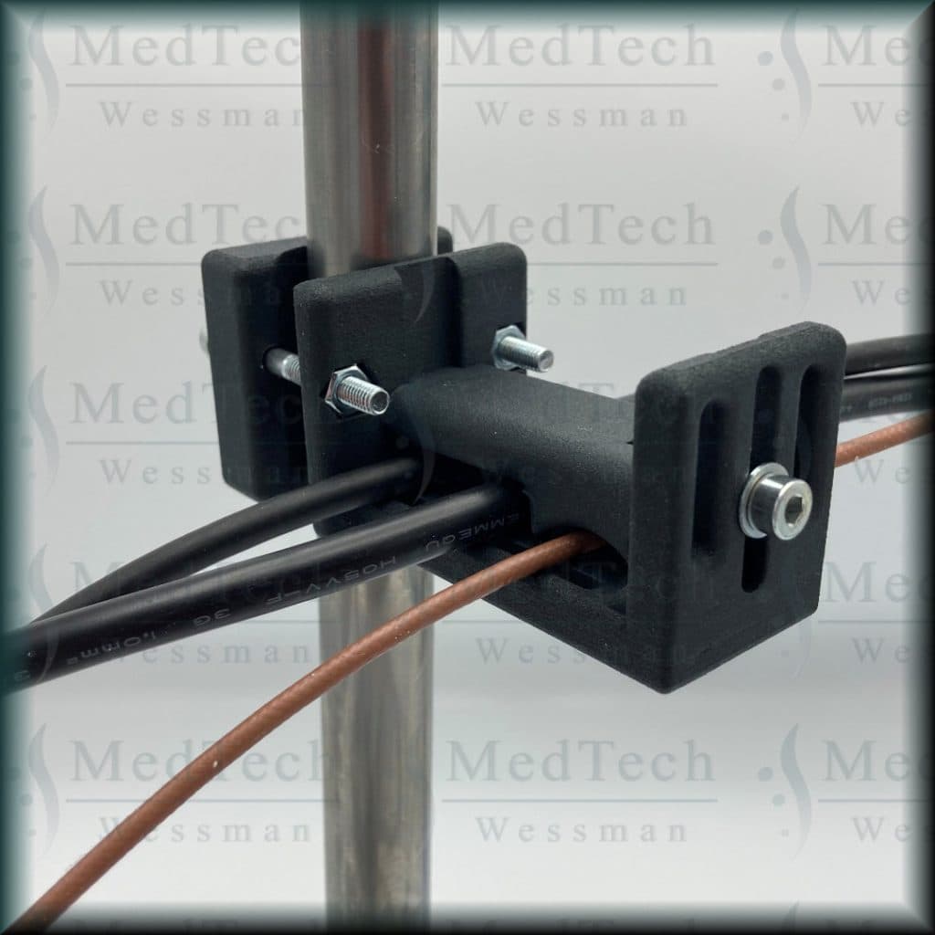 Cable holder / guide, instrument table. Adjustable clearance and dyed black (post-processing)