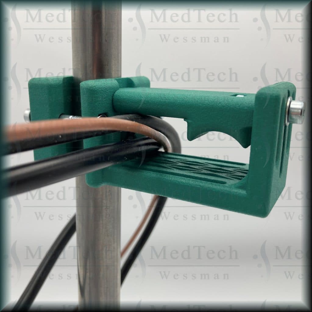 Cable holder / guide, instrument table. Adjustable clearance dyed green (post-processing)